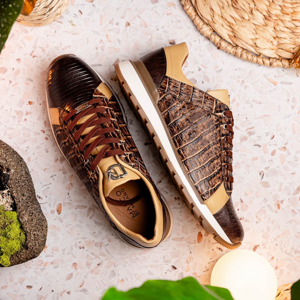 The Portici Orix / Brown by Marco Di Milano features a brown and tan faux crocodile texture, brown laces, white midsole, and a tan-brown rubber sole, delivering luxury style on a white background.