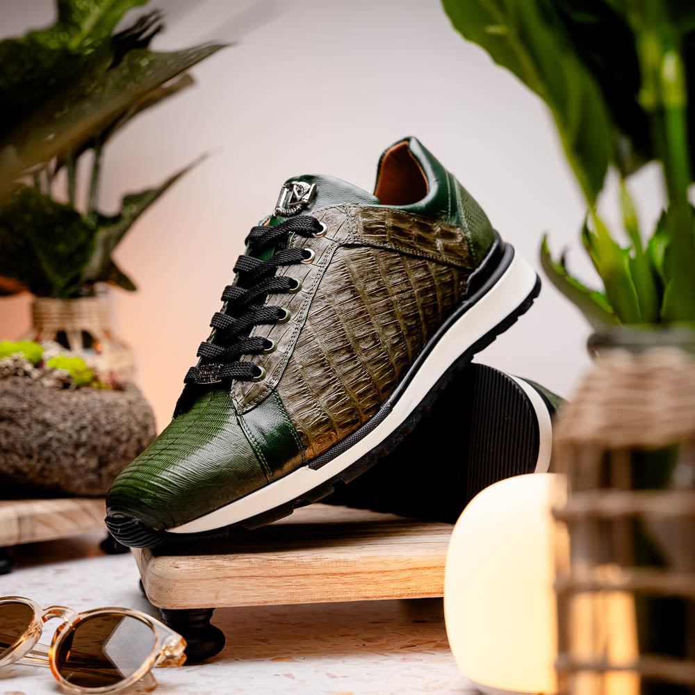 The Portici Green / Olive sneakers by Marco Di Milano feature green and brown leather with textured panels, black laces, rubber soles, and a unique hand-painted finish, all displayed against a plain white background.
