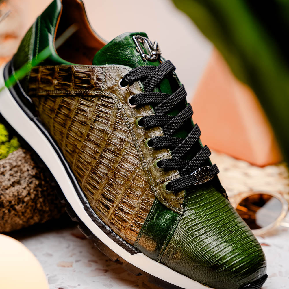 The Portici Green / Olive sneakers by Marco Di Milano feature green and brown leather with textured panels, black laces, rubber soles, and a unique hand-painted finish, all displayed against a plain white background.
