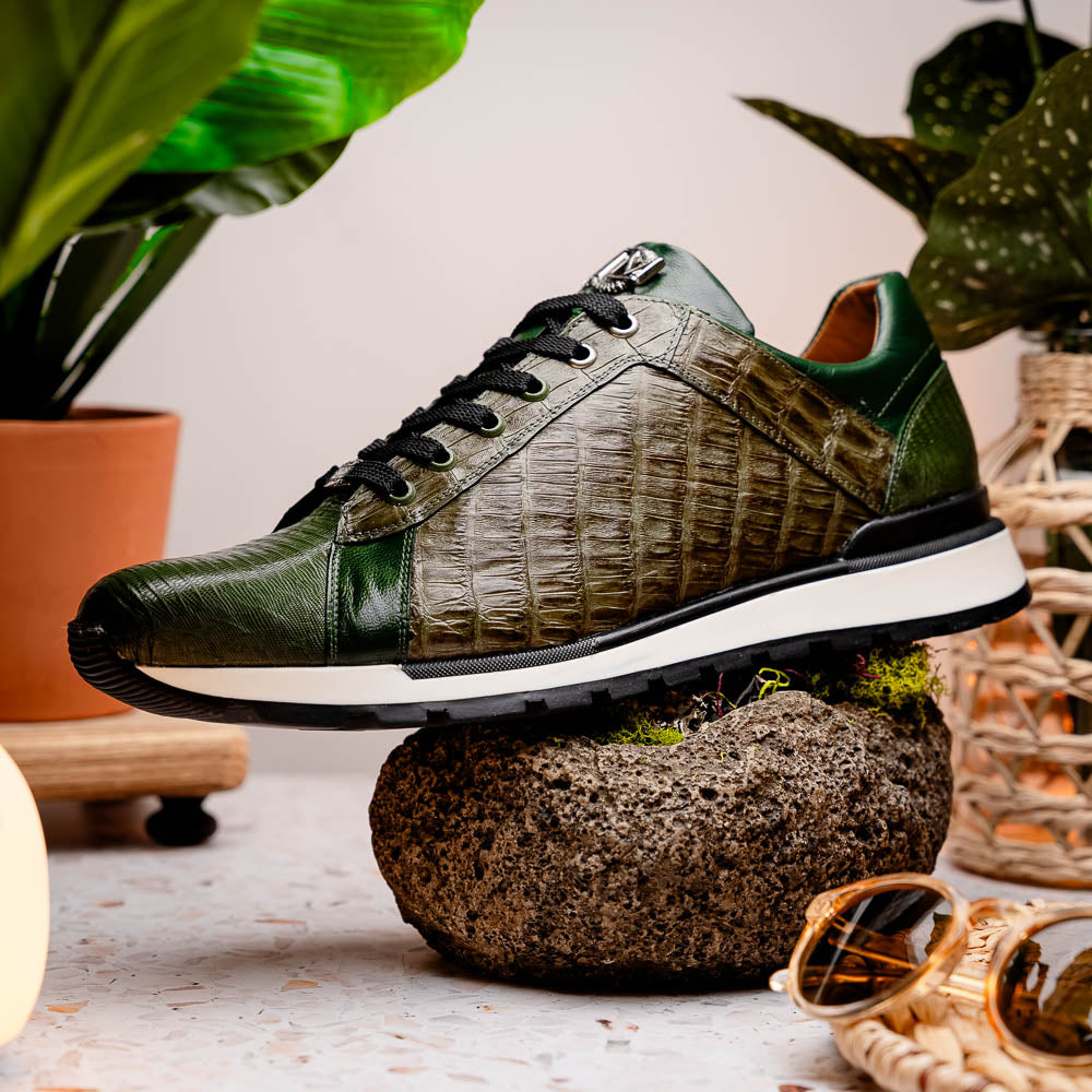 The Portici Green / Olive sneakers by Marco Di Milano feature green and brown leather with textured panels, black laces, rubber soles, and a unique hand-painted finish, all displayed against a plain white background.
