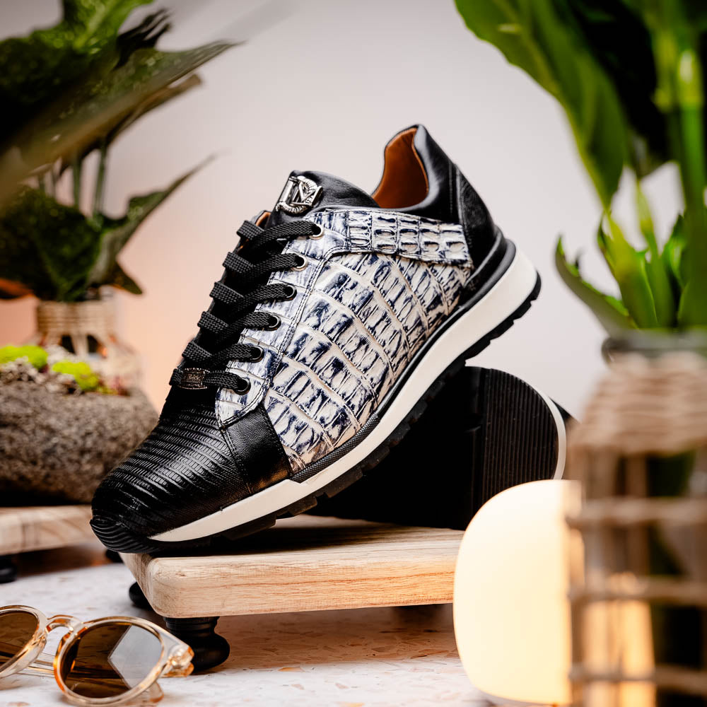 The Marco Di Milano Portici Newspaper / Black sneakers feature genuine crocodile leather in black and white with textured details and thick rubber soles, shown on a white background.