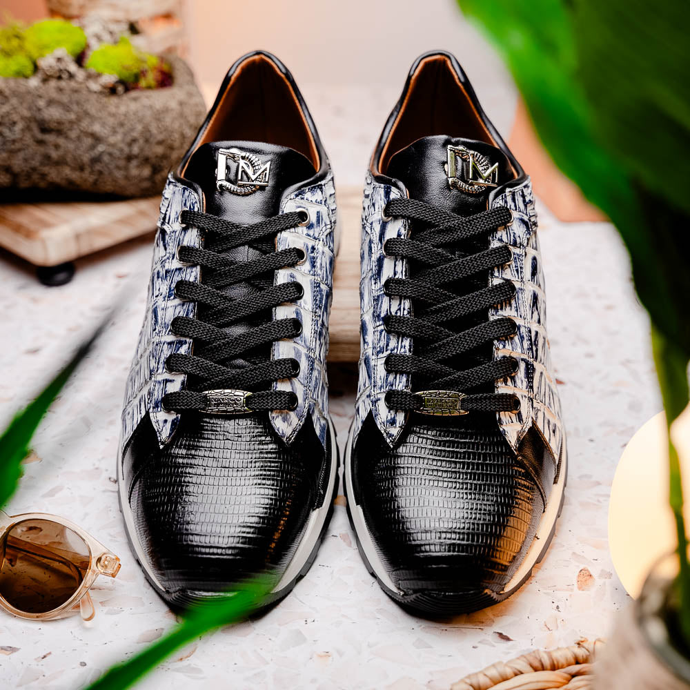 The Marco Di Milano Portici Newspaper / Black sneakers feature genuine crocodile leather in black and white with textured details and thick rubber soles, shown on a white background.