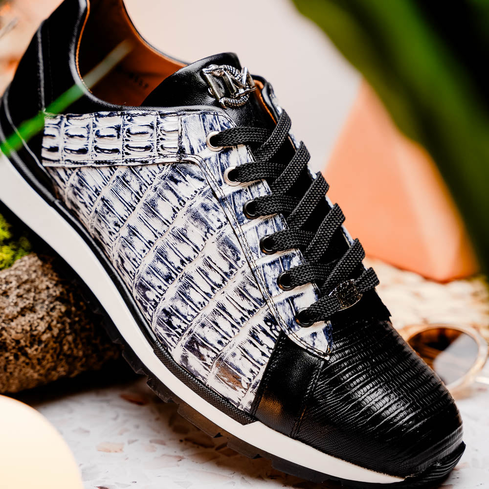 The Marco Di Milano Portici Newspaper / Black sneakers feature genuine crocodile leather in black and white with textured details and thick rubber soles, shown on a white background.