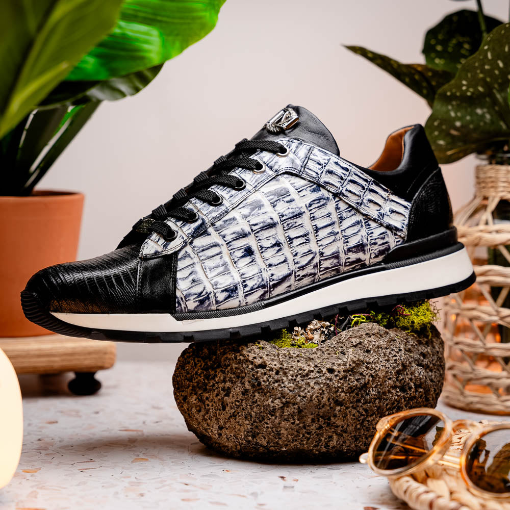 The Marco Di Milano Portici Newspaper / Black sneakers feature genuine crocodile leather in black and white with textured details and thick rubber soles, shown on a white background.