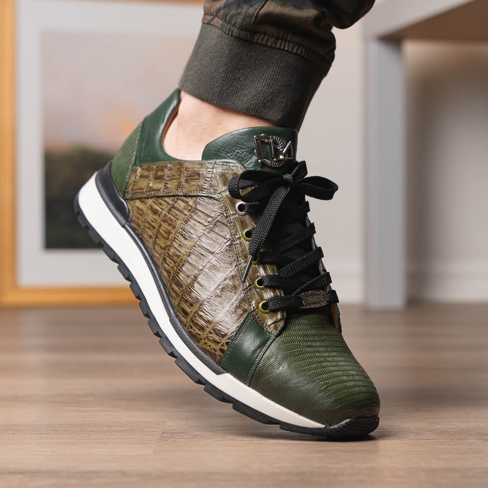 The Portici Green / Olive sneakers by Marco Di Milano feature green and brown leather with textured panels, black laces, rubber soles, and a unique hand-painted finish, all displayed against a plain white background.
