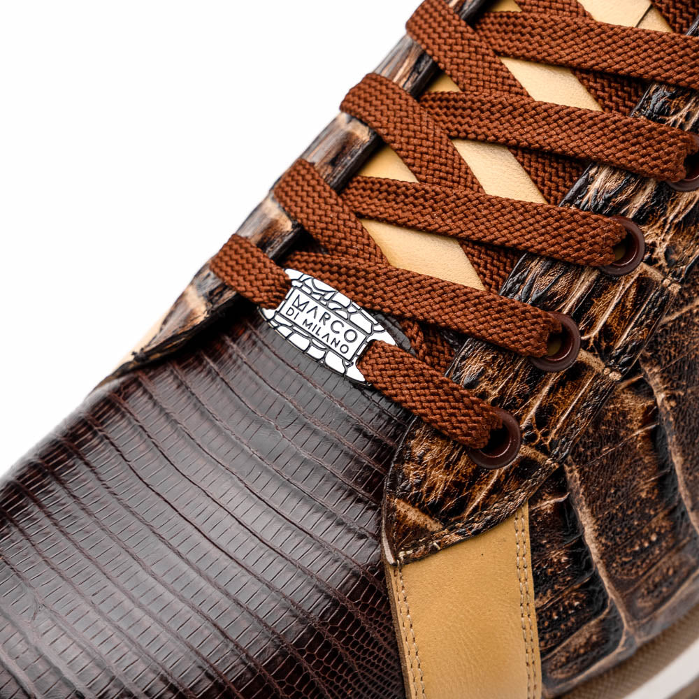 The Portici Orix / Brown by Marco Di Milano features a brown and tan faux crocodile texture, brown laces, white midsole, and a tan-brown rubber sole, delivering luxury style on a white background.
