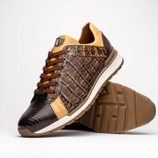 The Portici Orix / Brown by Marco Di Milano features a brown and tan faux crocodile texture, brown laces, white midsole, and a tan-brown rubber sole, delivering luxury style on a white background.