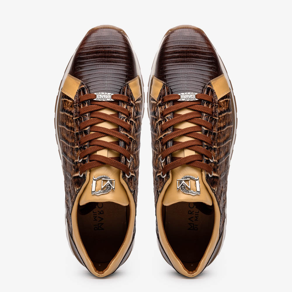The Portici Orix / Brown by Marco Di Milano features a brown and tan faux crocodile texture, brown laces, white midsole, and a tan-brown rubber sole, delivering luxury style on a white background.
