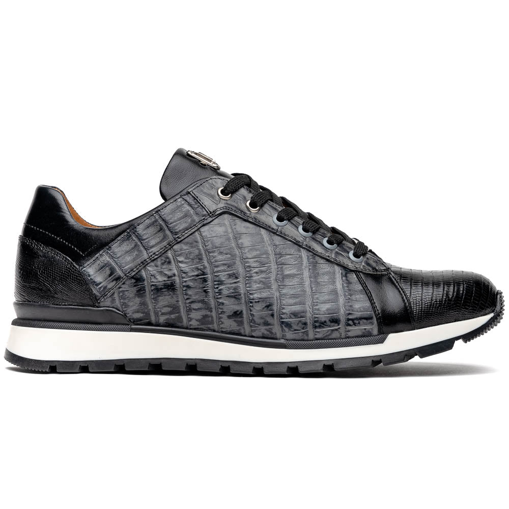 The Marco Di Milano Portici Gray / Black sneaker features black textured leather, black laces, and a white-trimmed rubber sole—one shoe upright and the other on its side—offering luxury footwear with a refined finish.