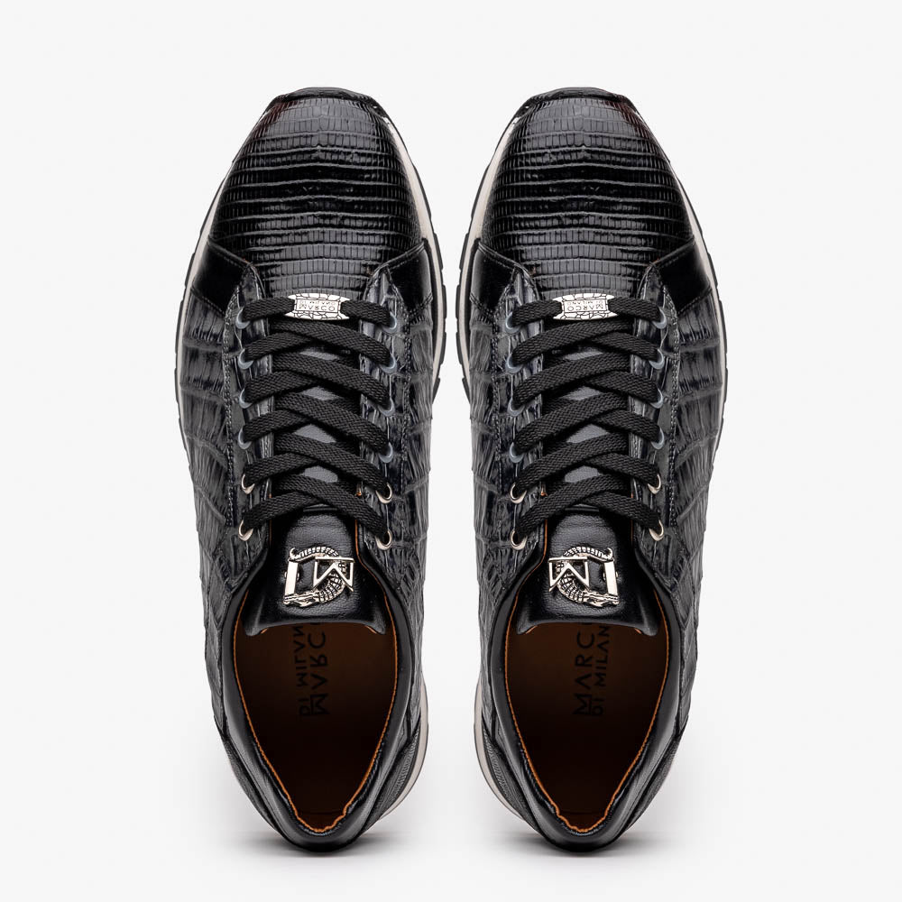 The Marco Di Milano Portici Gray / Black sneaker features black textured leather, black laces, and a white-trimmed rubber sole—one shoe upright and the other on its side—offering luxury footwear with a refined finish.