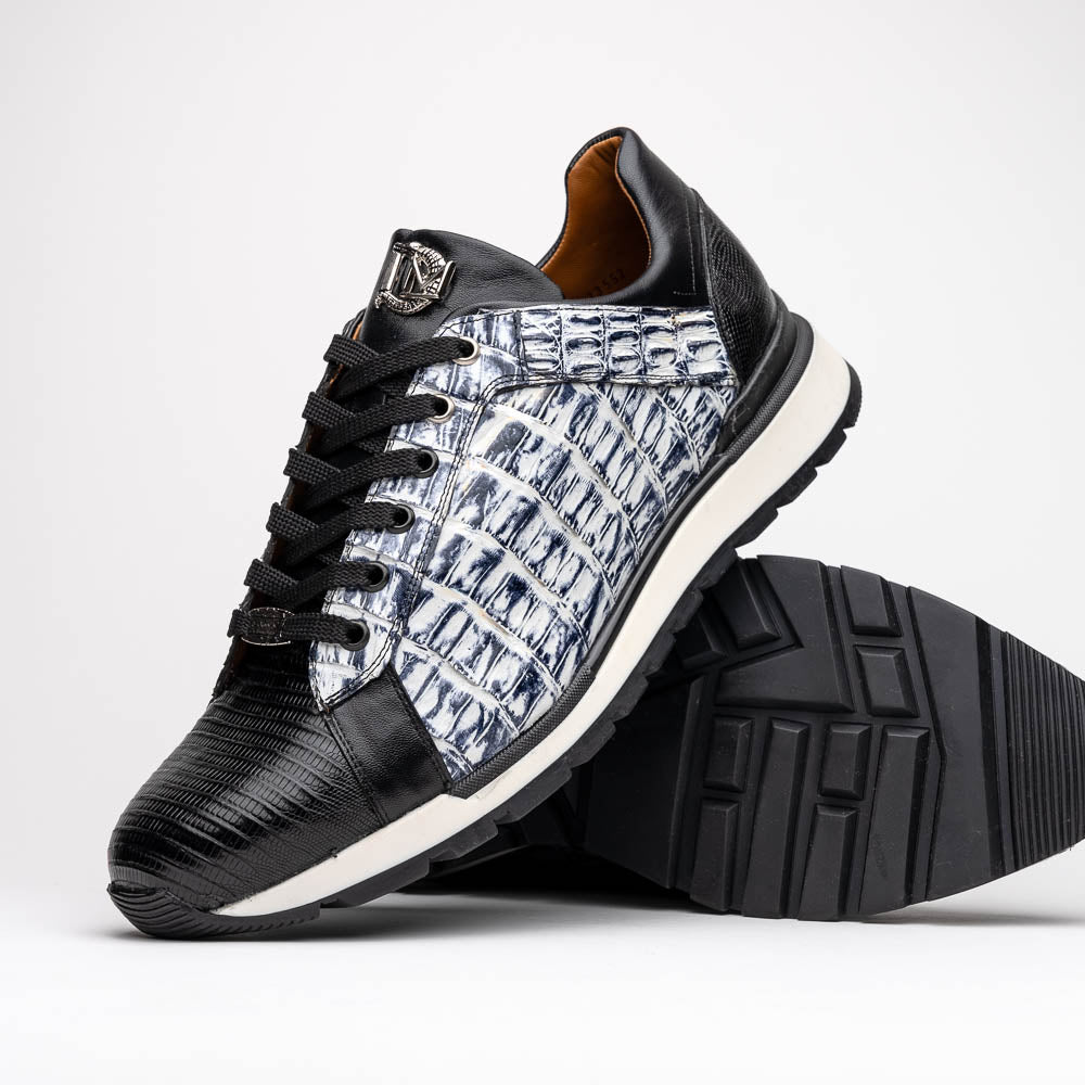 The Marco Di Milano Portici Newspaper / Black sneakers feature genuine crocodile leather in black and white with textured details and thick rubber soles, shown on a white background.