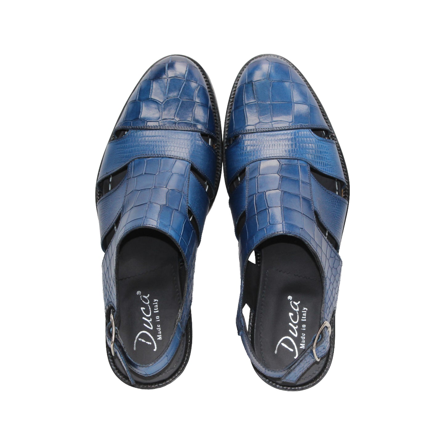 The Duca Di Matiste Duca Positano Ocean Blue is a closed-toe sandal with cut-out sides, an adjustable heel strap, and textured leather, showcasing Italian craftsmanship against a white background.