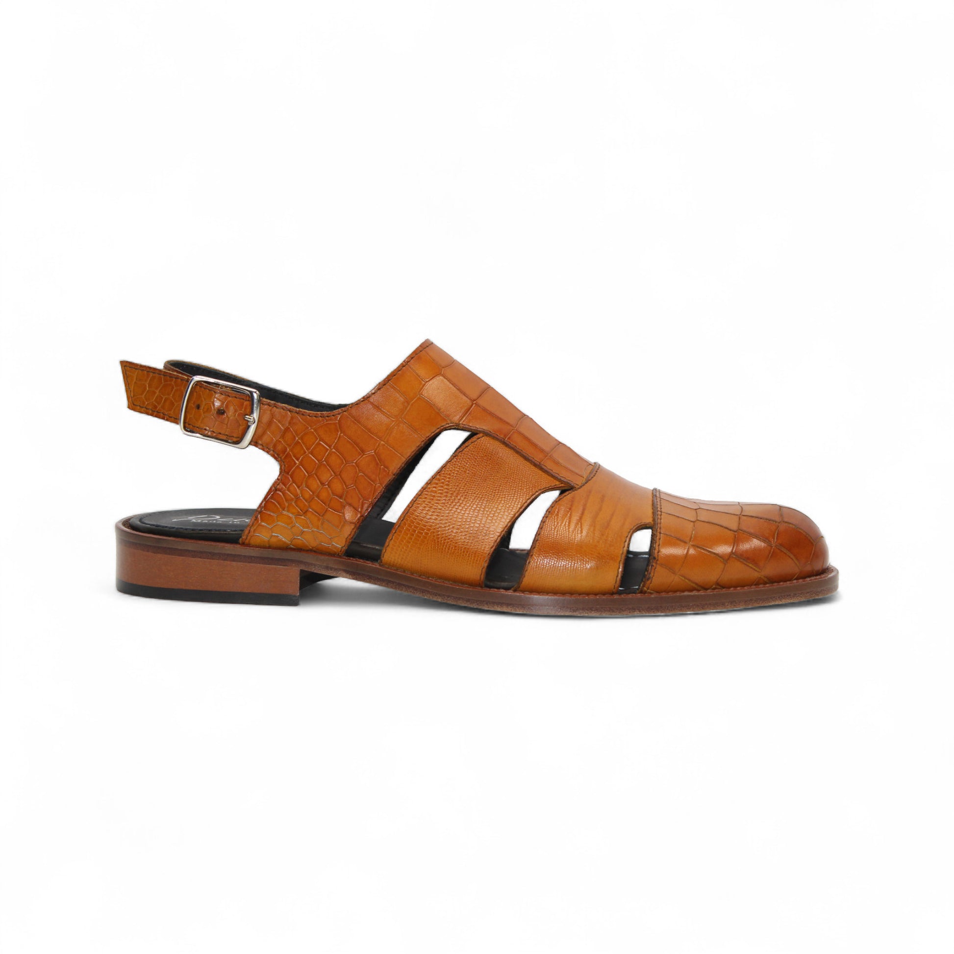 The Duca Di Matiste Positano (Cognac) is a brown croco embossed leather sandal with closed toe, cut-out sides, slingback strap with buckle, a textured pattern, and flat sole. Expertly crafted in Italy by Duca Di Matiste.