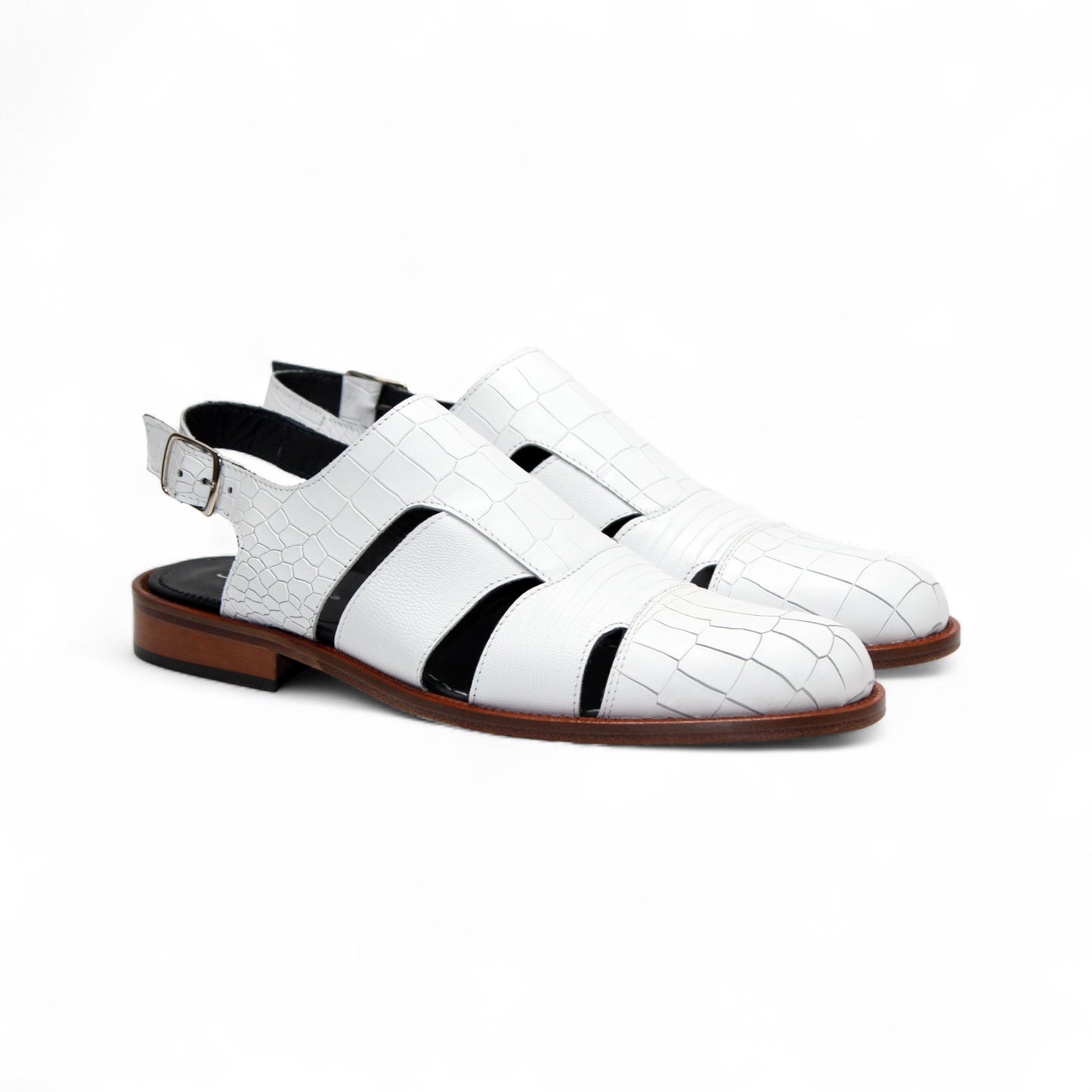 The Duca Di Matiste Positano (White) sandal by Duca Di Matiste features white croco leather, a closed toe, cutout sides, ankle strap with buckle, and brown sole, shown on a plain white background.