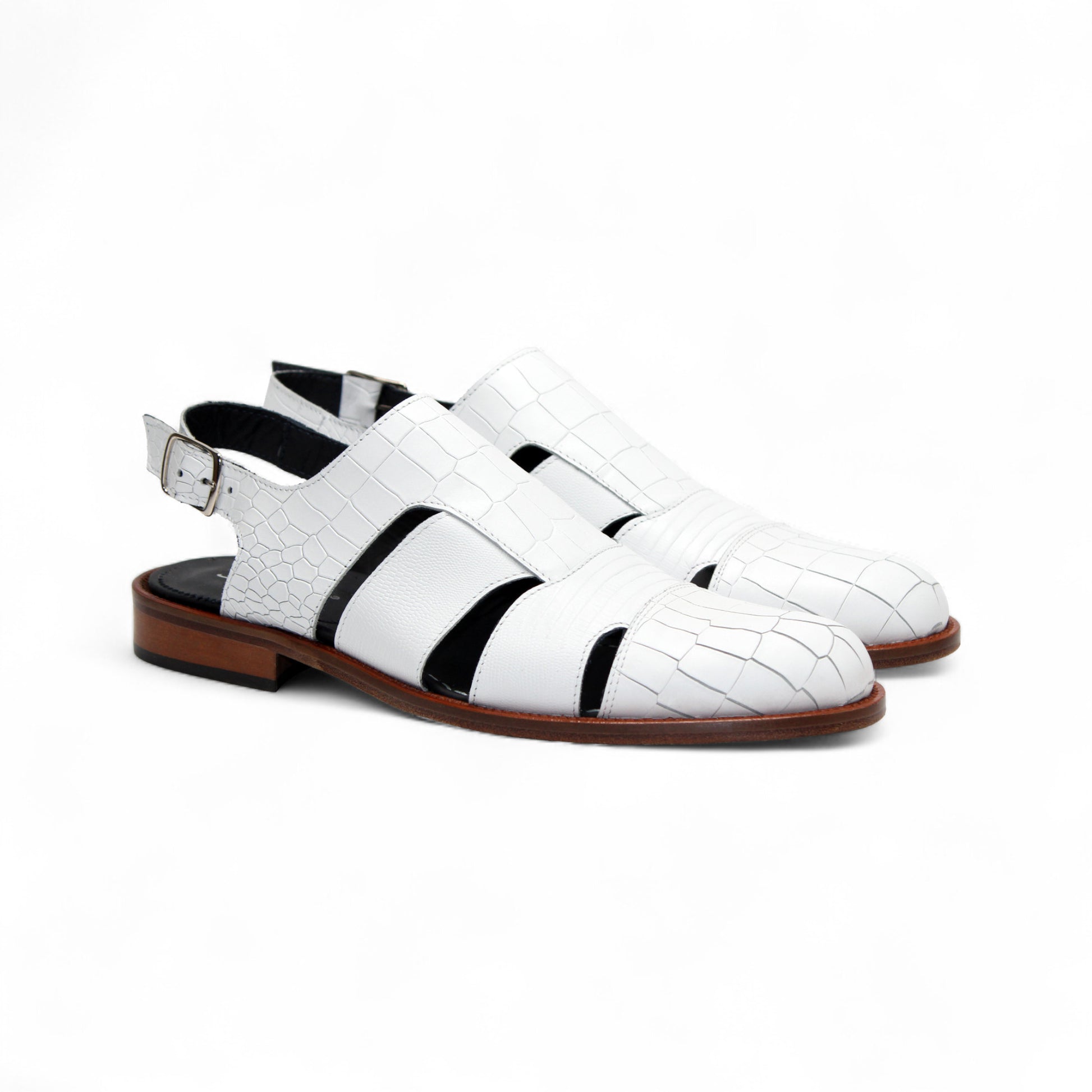 The Duca Di Matiste Positano (White) sandal by Duca Di Matiste features white croco leather, a closed toe, cutout sides, ankle strap with buckle, and brown sole, shown on a plain white background.