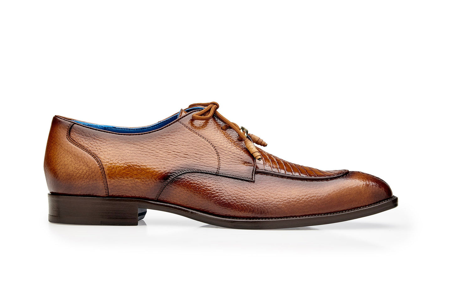 Belvedere's Primo dress shoes, made from genuine American alligator and pebble grain calf leather, showcase a textured design with laces on top, highlighted against a plain white background.