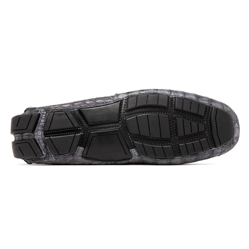 The Remo Gray driving loafers by Marco Di Milano feature a textured gray upper and rubber sole, with one shoe upright and the other leaning—ideal for genuine exotic footwear enthusiasts.
