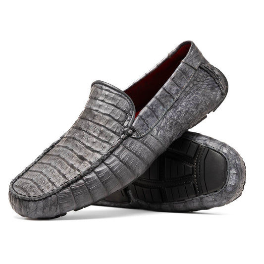 The Remo Gray driving loafers by Marco Di Milano feature a textured gray upper and rubber sole, with one shoe upright and the other leaning—ideal for genuine exotic footwear enthusiasts.