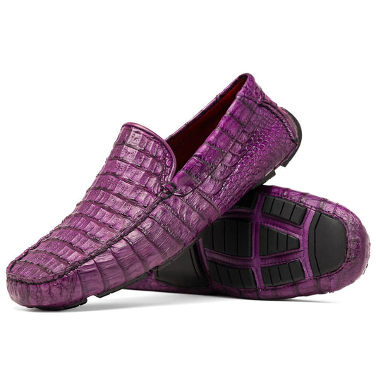 The Remo Purple by Marco Di Milano: a pair of crocodile-patterned purple leather driving loafers, one upright and one on its side revealing the black rubber sole—luxury men's footwear at its finest.