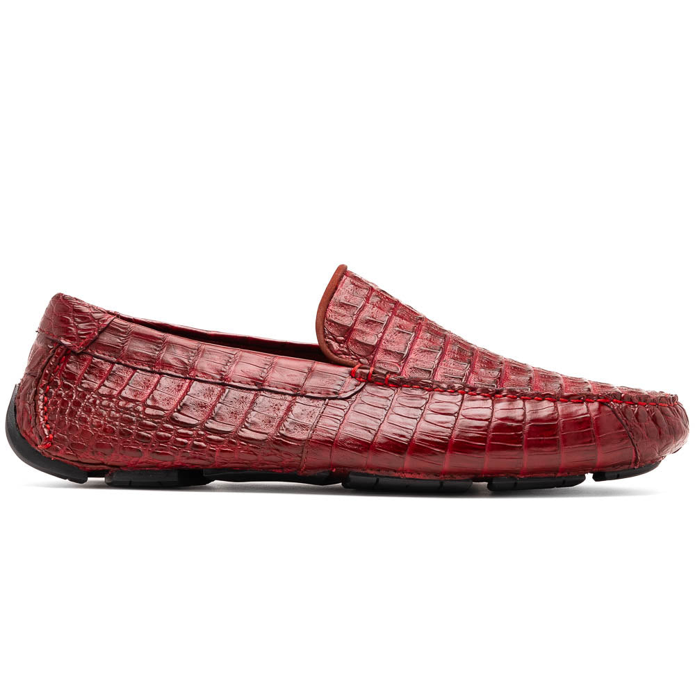 The Marco Di Milano Remo Wine features red crocodile-pattern leather driving shoes: one upright, one on its side showing a black rubber sole with red highlights—ideal for luxury men's footwear enthusiasts.