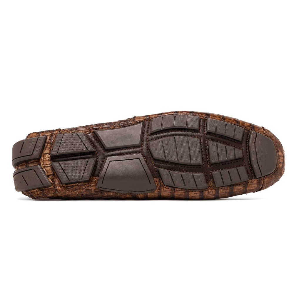 The Remo Washed Brown by Marco Di Milano features luxurious men's loafers with a crocodile texture. One shoe stands upright while the other lies on its side, revealing the detailed sole.