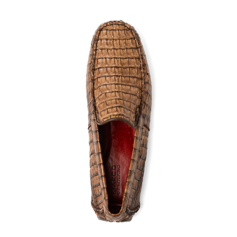 The Remo Washed Brown by Marco Di Milano features luxurious men's loafers with a crocodile texture. One shoe stands upright while the other lies on its side, revealing the detailed sole.