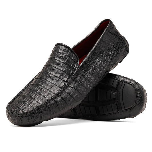 The Remo Black by Marco Di Milano: a pair of black textured driving loafers with a crocodile pattern—one upright, one showing the sole—making a bold statement in luxury men's footwear.