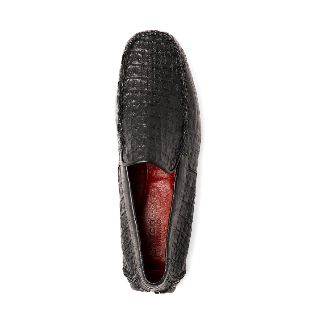 The Remo Black by Marco Di Milano: a pair of black textured driving loafers with a crocodile pattern—one upright, one showing the sole—making a bold statement in luxury men's footwear.