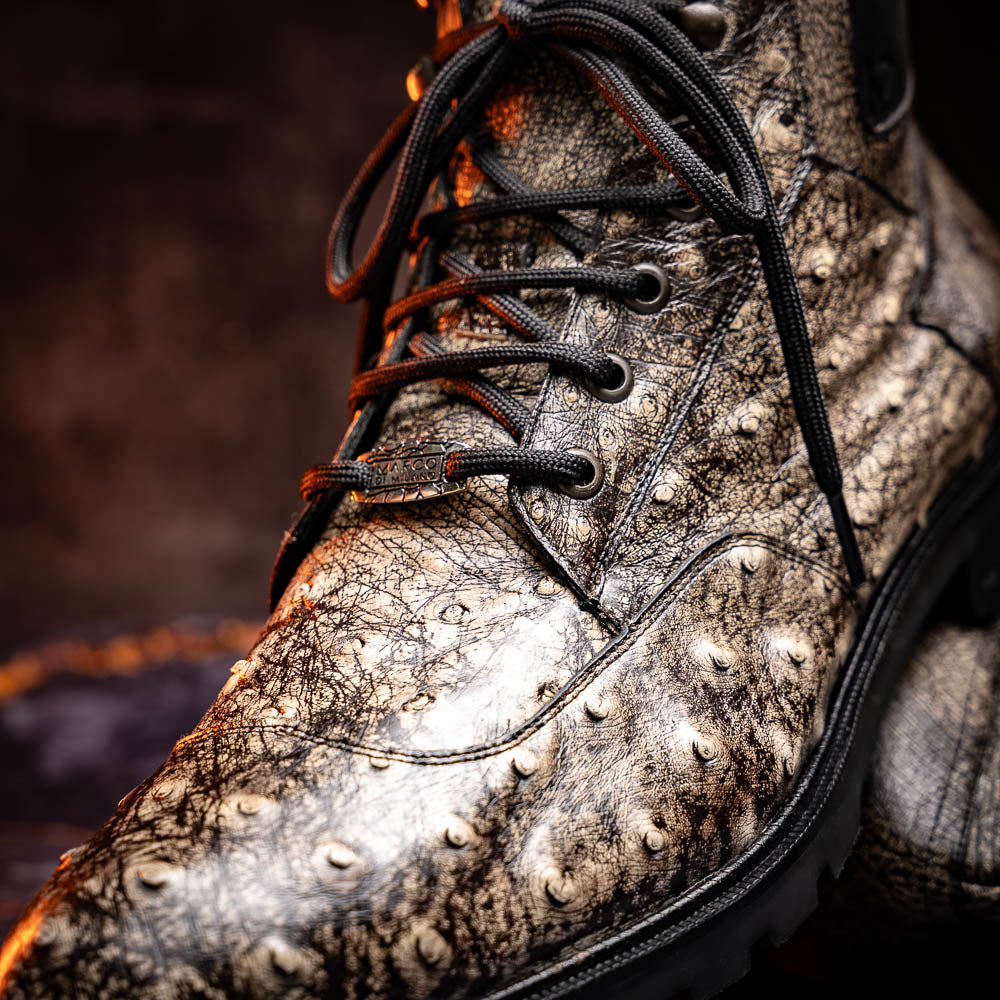 The Renzo Stone Black boots by Marco Di Milano feature genuine ostrich leather in brown, black laces, and black rubber soles—luxury footwear with a unique exotic flair.