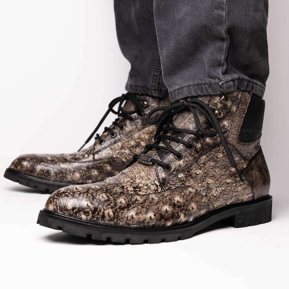 The Renzo Stone Black boots by Marco Di Milano feature genuine ostrich leather in brown, black laces, and black rubber soles—luxury footwear with a unique exotic flair.