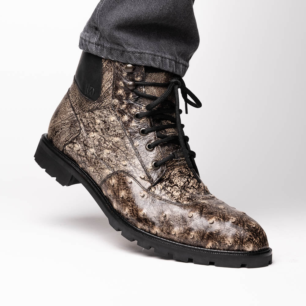 The Renzo Stone Black boots by Marco Di Milano feature genuine ostrich leather in brown, black laces, and black rubber soles—luxury footwear with a unique exotic flair.