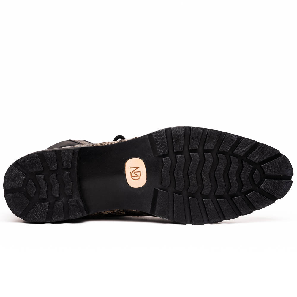 The Renzo Stone Black boots by Marco Di Milano feature genuine ostrich leather in brown, black laces, and black rubber soles—luxury footwear with a unique exotic flair.