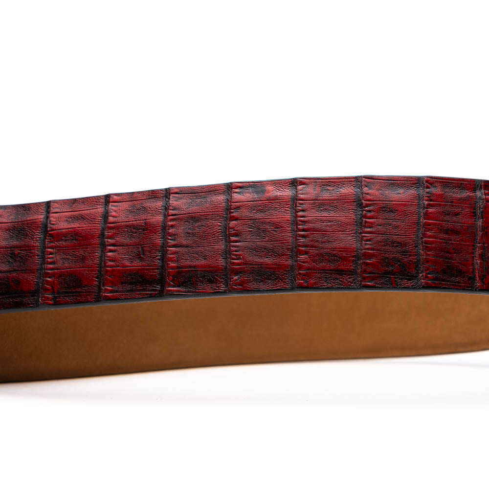 The Riccardo Belt Black Cherry by Marco Di Milano is a genuine caiman fuscus-belly belt in red and black, featuring a silver buckle engraved with the brand’s logo—perfect for lovers of fine exotics.