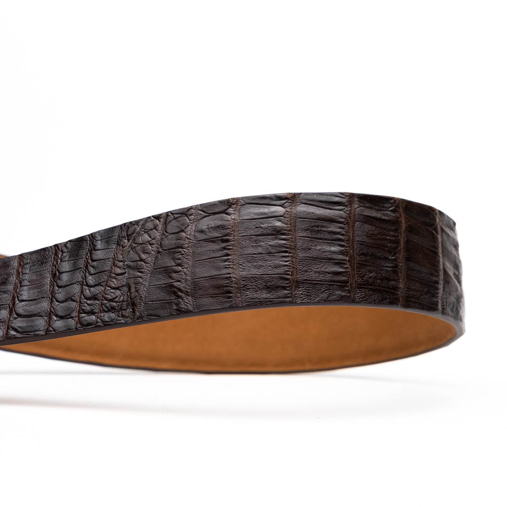 The Riccardo Belt Dark Brown by Marco Di Milano is crafted from exotic leather with a crocodile pattern and features a silver buckle engraved with the brand's name and logo.