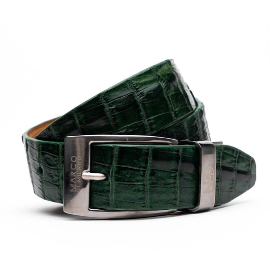 The Riccardo Belt Forest Green by Marco Di Milano features crocodile-embossed dark green leather and a silver buckle engraved with the brand logo, displayed coiled on a white background.