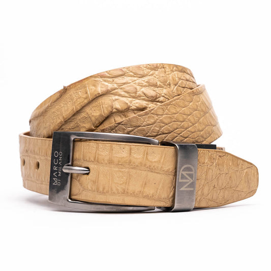 The Riccardo Belt Orix by Marco Di Milano is a rolled tan caiman fuscus-belly belt with an engraved silver buckle, shown on a white background—a genuine exotic accessory.