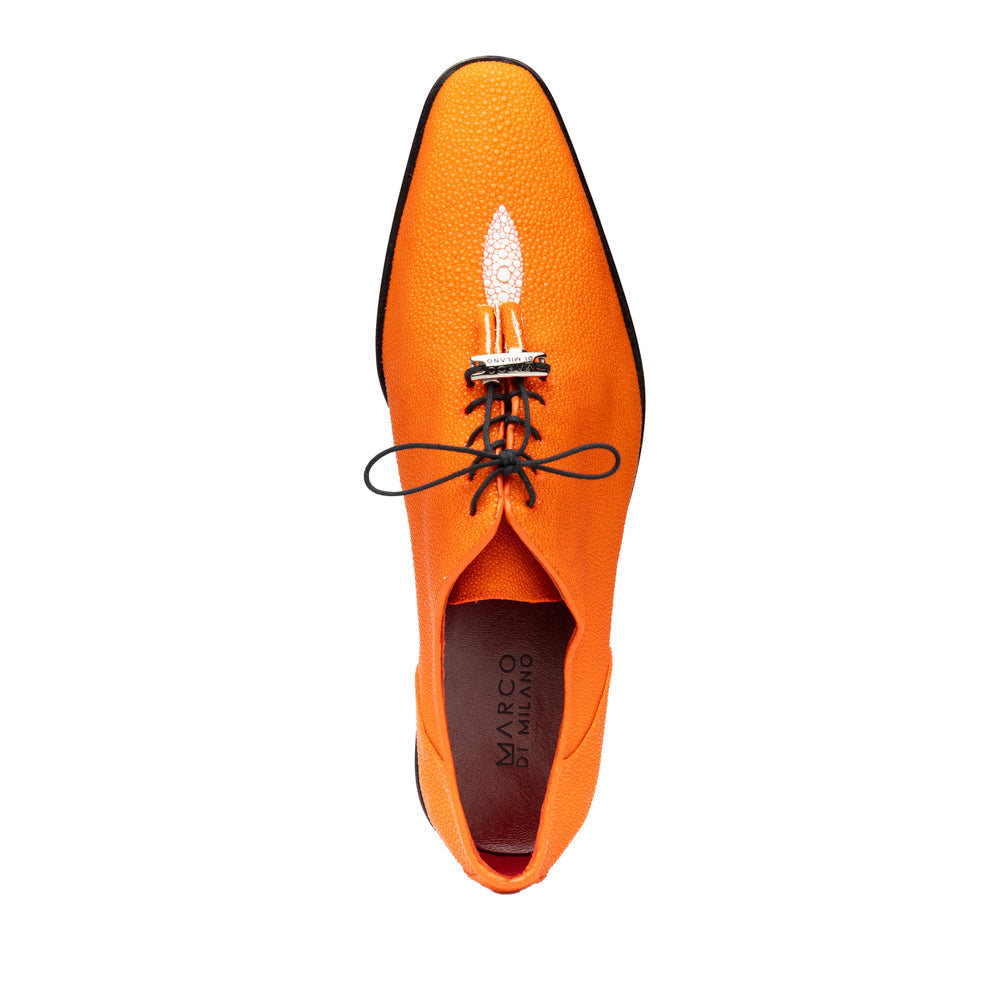 Rimini Orange men’s exotic lace-up dress shoes by Marco Di Milano, expertly crafted from genuine stingray leather in a bright orange hue with black laces; one shoe stands upright while the other lies on its side, showcasing the vibrant red sole and contrasting black heel.