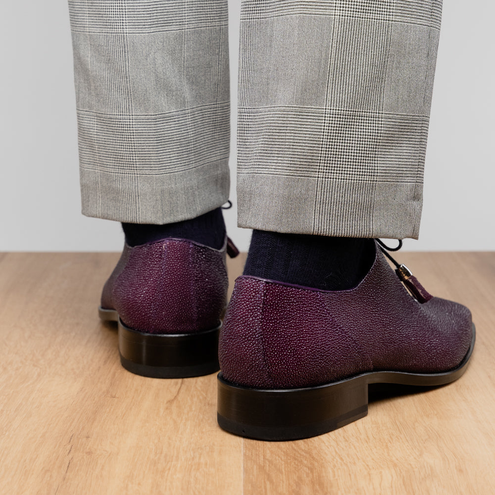 The Rimini Purple by Marco Di Milano is a single purple textured exotic lace-up shoe with black laces, shown from above, featuring a decorative metal and crystal accessory on the tongue.