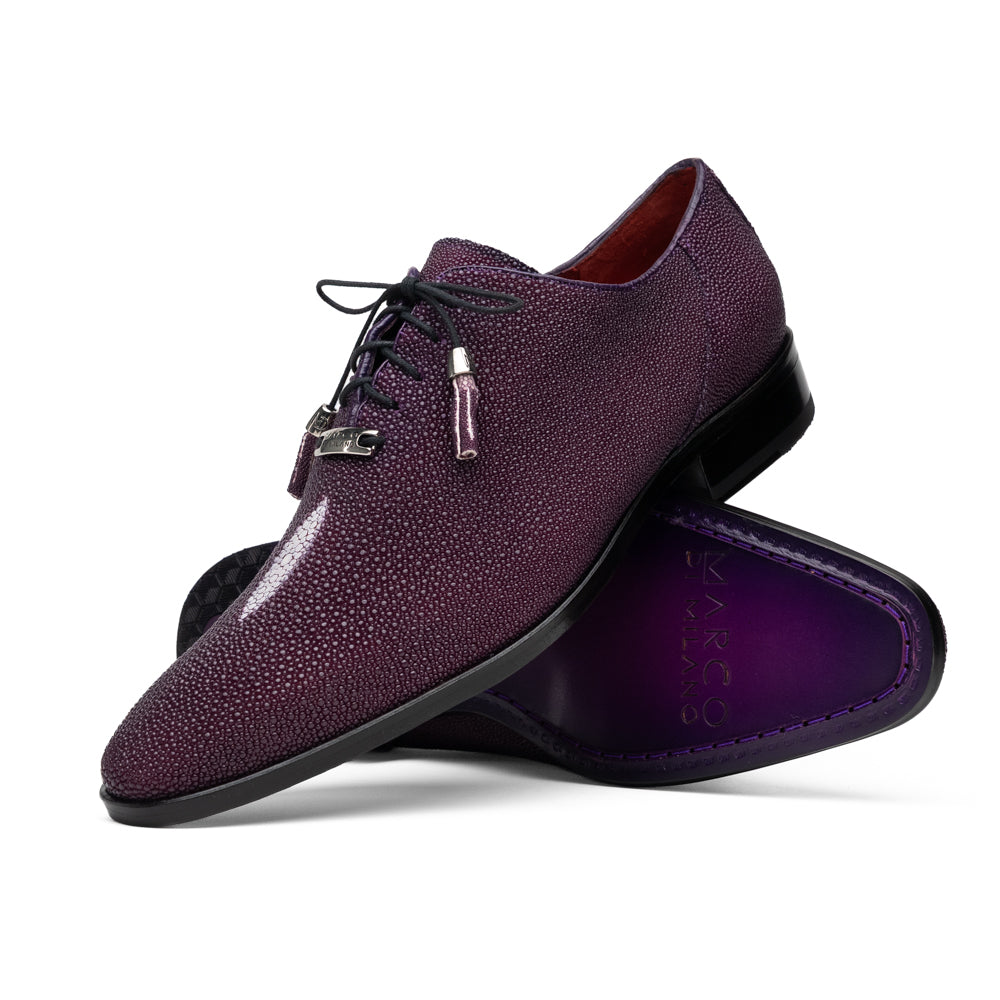 The Rimini Purple by Marco Di Milano is a single purple textured exotic lace-up shoe with black laces, shown from above, featuring a decorative metal and crystal accessory on the tongue.
