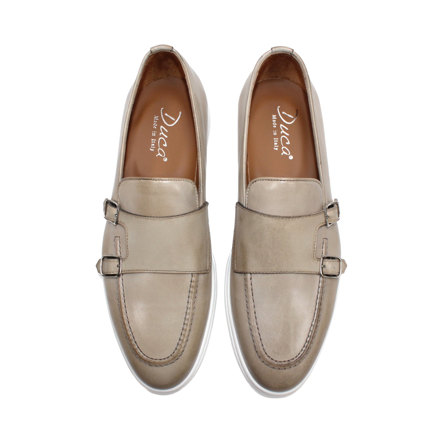The Duca Rimini Beige by Duca Di Matiste is an Italian-crafted loafer in premium calf leather with a white rubber sole and metal buckle, shown in profile on a plain white background—ideal for timeless sophistication.