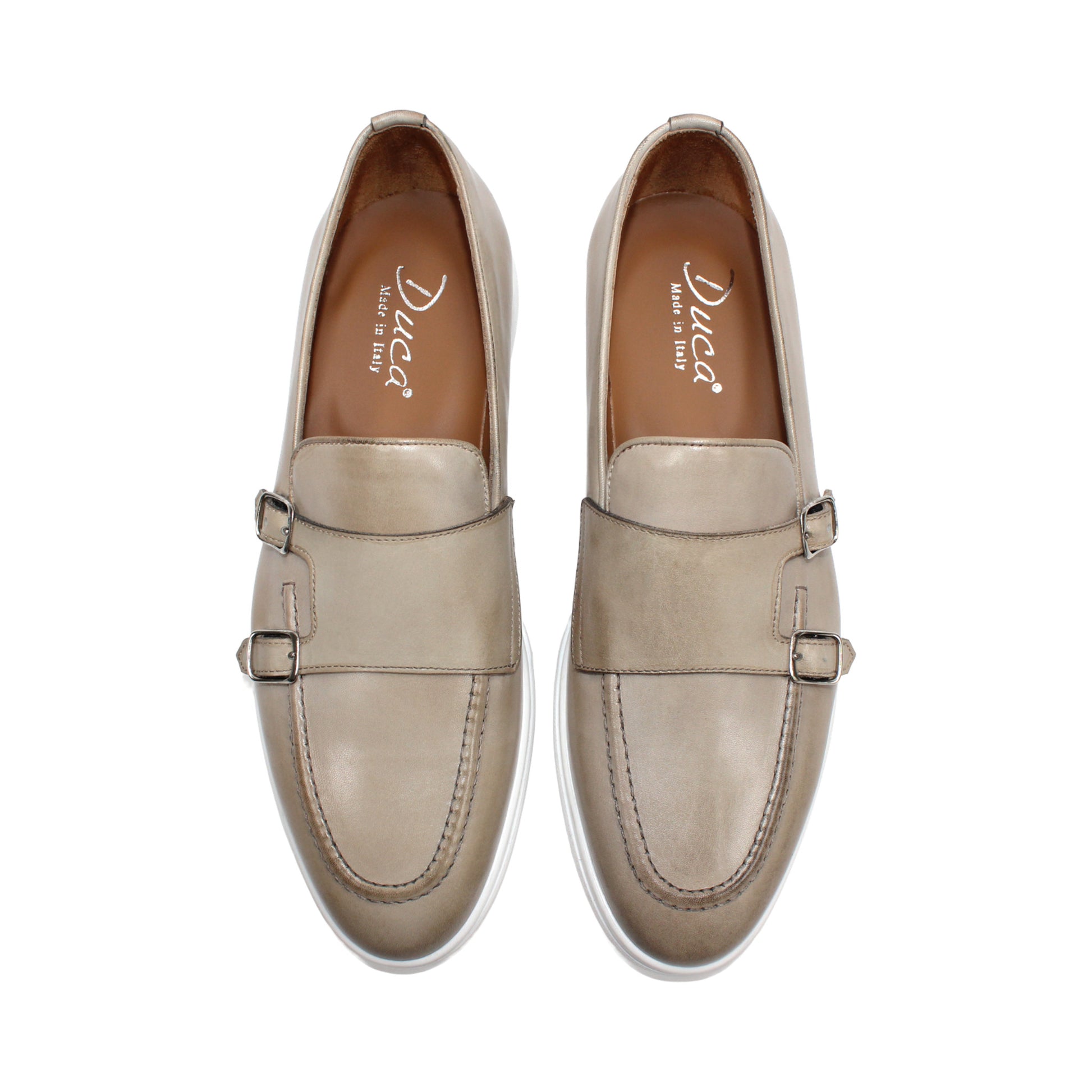 The Duca Rimini Beige by Duca Di Matiste is an Italian-crafted loafer in premium calf leather with a white rubber sole and metal buckle, shown in profile on a plain white background—ideal for timeless sophistication.