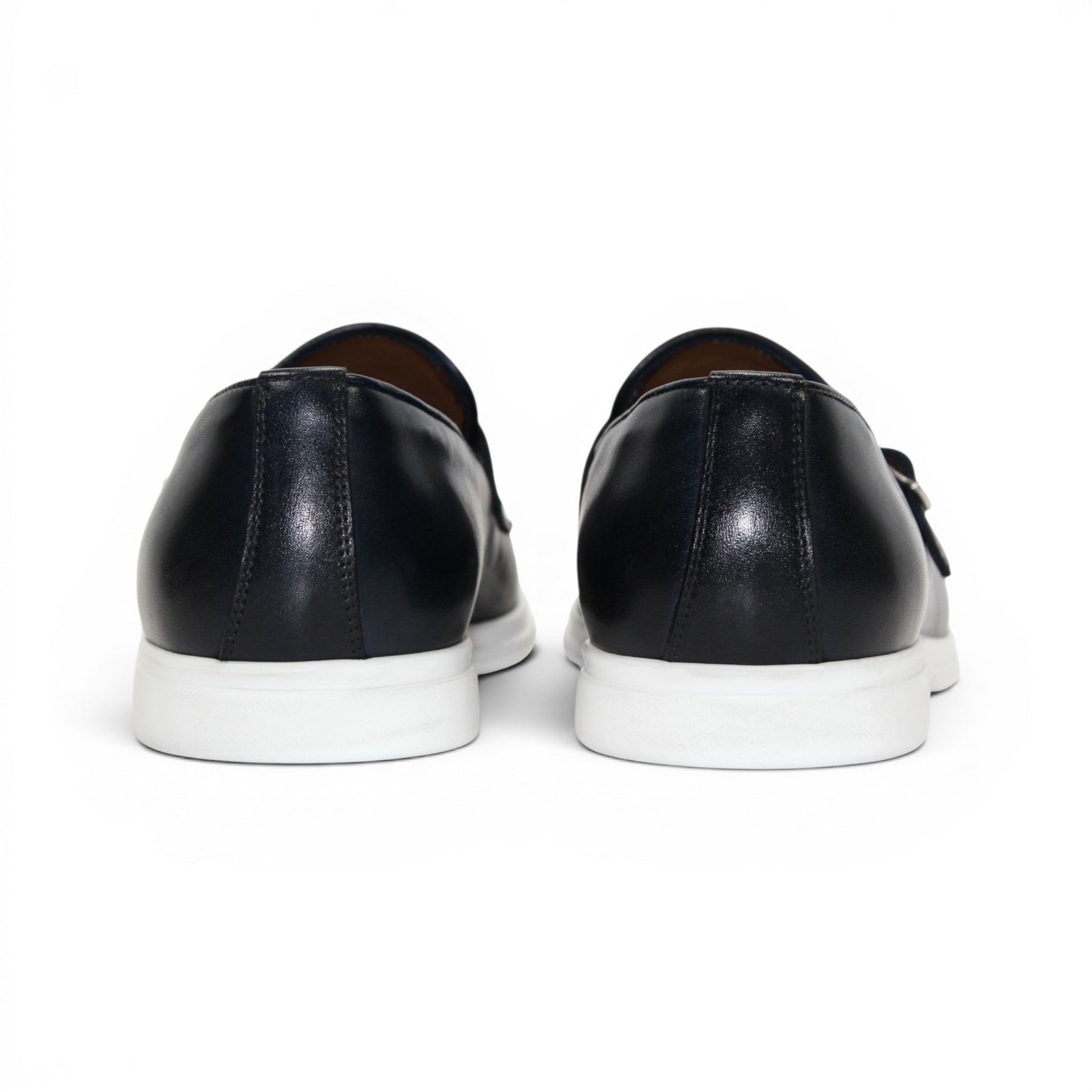 The Duca Rimini Navy by Duca Di Matiste, crafted in premium navy calf leather with double buckle straps and a white rubber sole, is displayed in profile on a plain white background, exuding timeless sophistication.