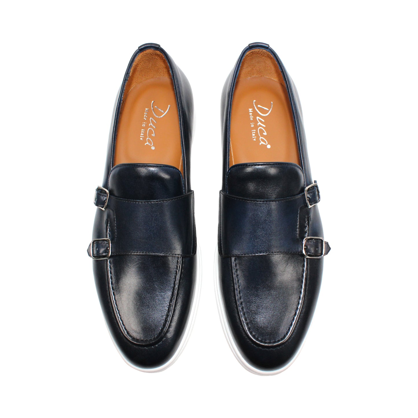 The Duca Rimini Navy by Duca Di Matiste, crafted in premium navy calf leather with double buckle straps and a white rubber sole, is displayed in profile on a plain white background, exuding timeless sophistication.
