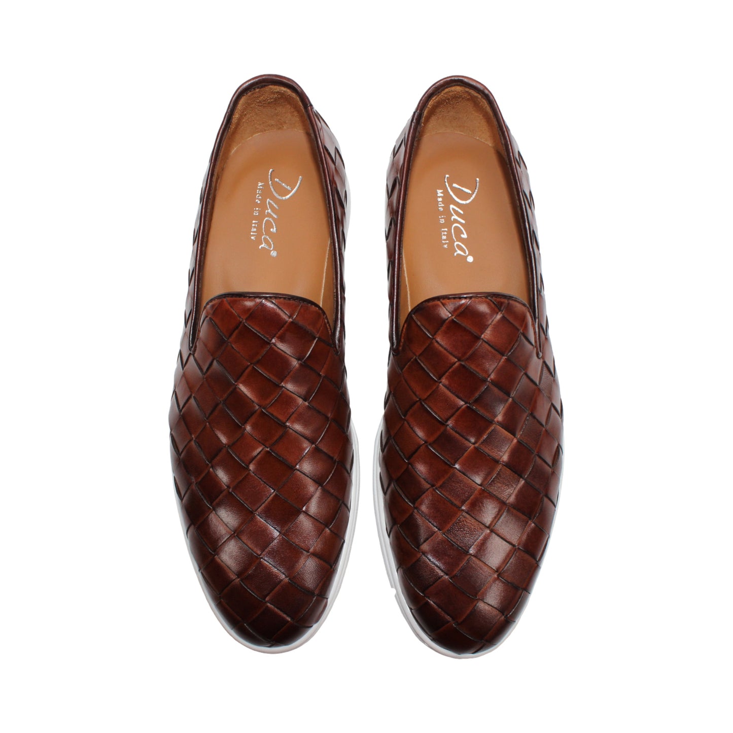 The Duca Di Matiste Duca Rivoli Marrone is a brown woven leather slip-on with a white rubber sole, displayed in side view against a plain white background, highlighting luxury footwear.