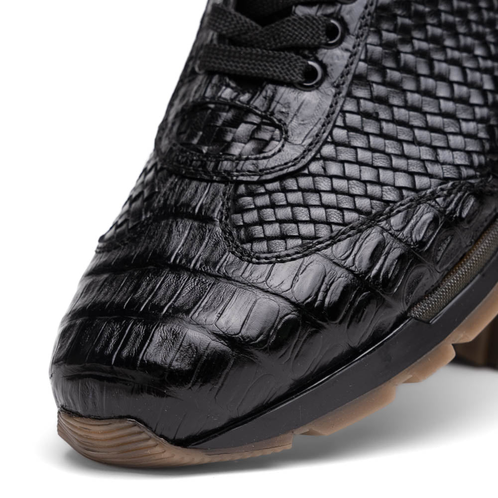 The Marco Di Milano Roma Black features luxury black woven calfskin sneakers with black laces and brown rubber soles—one shoe stands upright while the other leans against it.