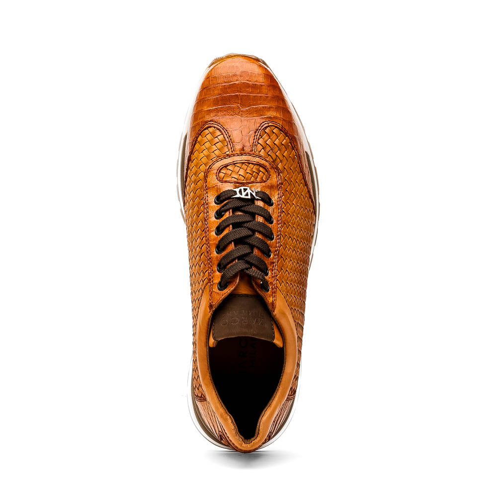 The Roma Brandy sneakers by Marco Di Milano feature brown woven calfskin, textured toe and heel, black laces, white midsoles, and brown rubber outsoles. One shoe stands upright while the other lies on its side.