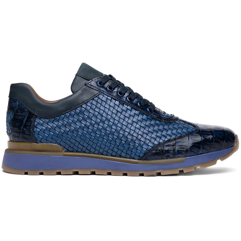 A pair of Marco Di Milano's Roma Navy sneakers: blue woven calfskin with brown rubber soles, one upright and the other leaning, highlighting the distinct tread pattern in elegant style.