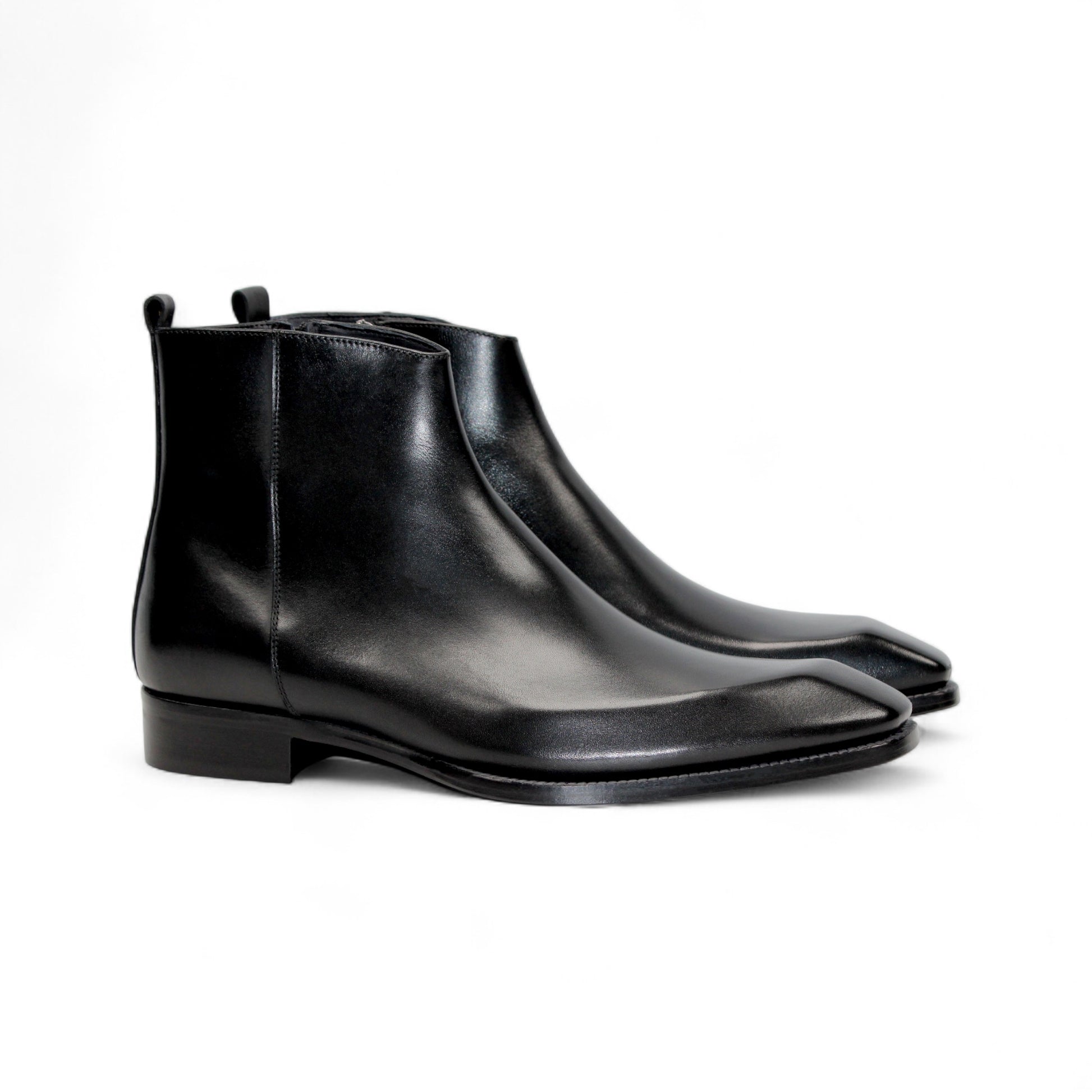 The Duca Di Matiste Duca Romano Black ankle boot features black leather, a low heel, and side zipper, expertly handcrafted in Italy and shown in profile on a plain white background.