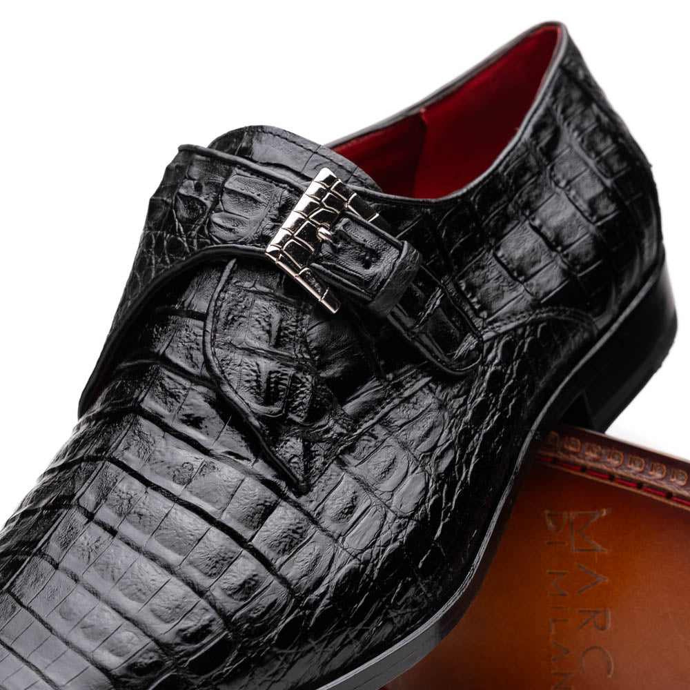 The Marco Di Milano Rovigo Black is a luxury monk strap dress shoe featuring genuine caiman crocodile, a pointed toe, metal buckle, and brown leather sole, displayed on a clean white background.