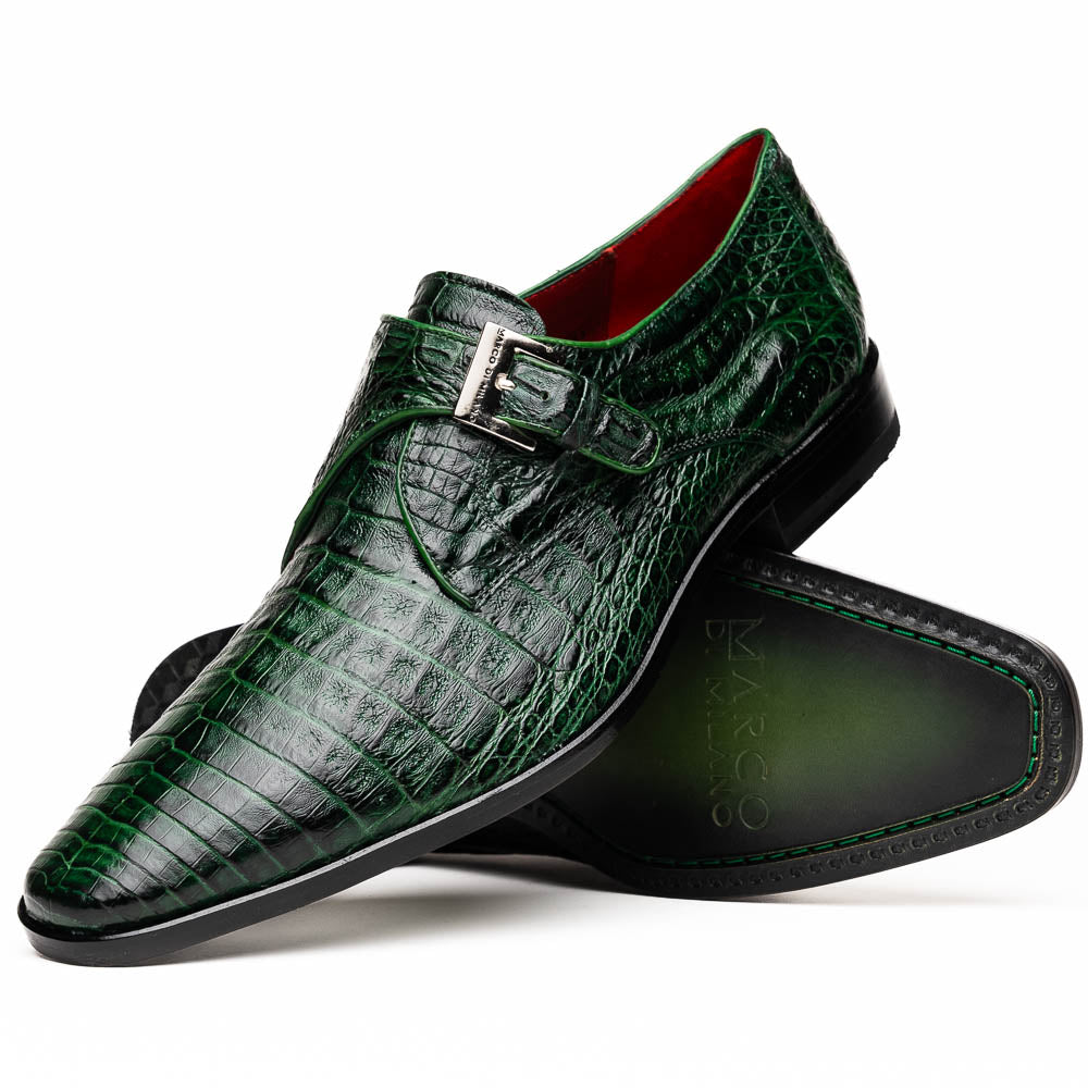 The Marco Di Milano Rovigo Forest Green features genuine caiman crocodile leather and a luxury monk strap, with one dress shoe propped to reveal its sole—a bold statement among men's exotic dress shoes.